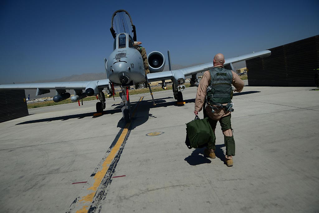 U.S. Air Force Maj. Vincent Sherer, 455th Air Expeditionary Wing pilot, walks toward an A-10 Thunderbolt II aircraft at Bagram Airfield, Afghanistan Aug. 5, 2014. Sherer has been flying for 12 years and has deployed to Bagram four times. He is deployed from Davis-Monthan Air Force Base, Ariz. and a native of Portland, Ore. (U.S. Air Force photo by Staff Sgt. Evelyn Chavez/Released)