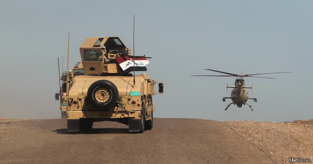 Iraqi army vehicles helicopter in Anbar